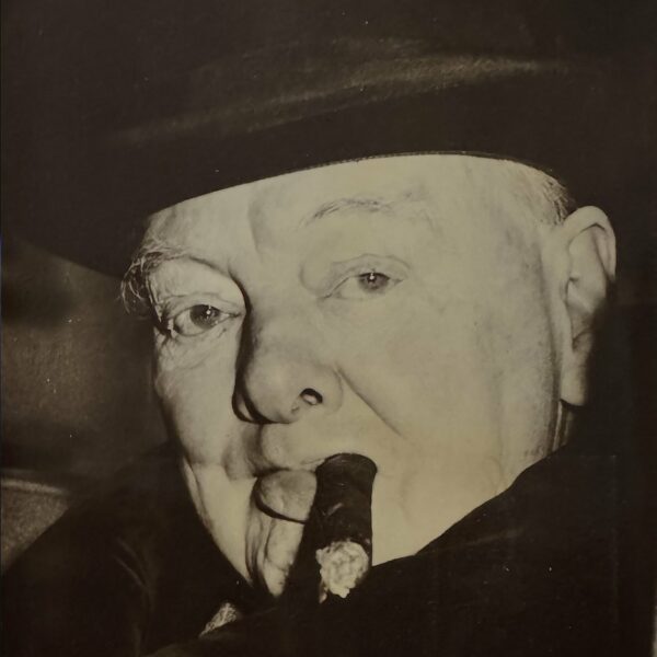 A moving photograph of Winston Churchill, cigar in hand. 1963.