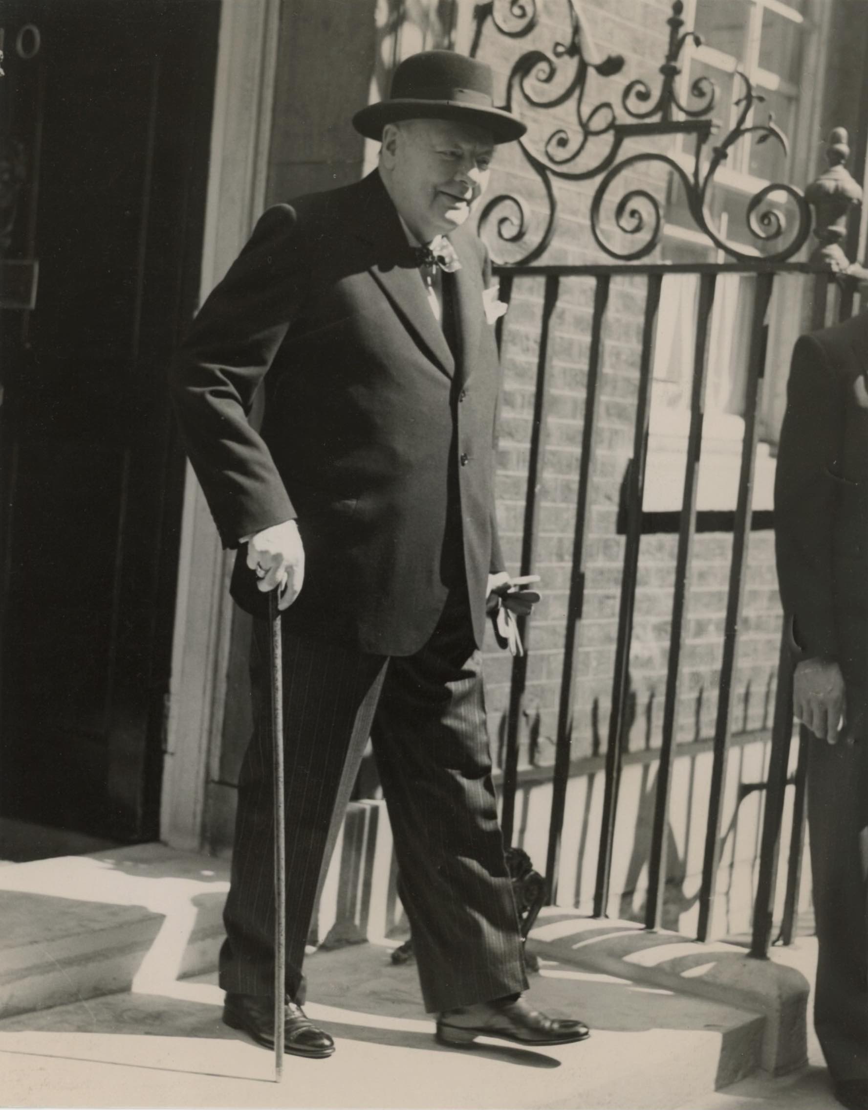 Winston Curchill, smiling, leaves 10 Downing Street in London. 1952.
